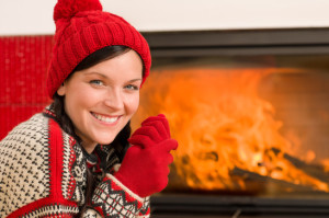 Woman by Christmas Fireplace