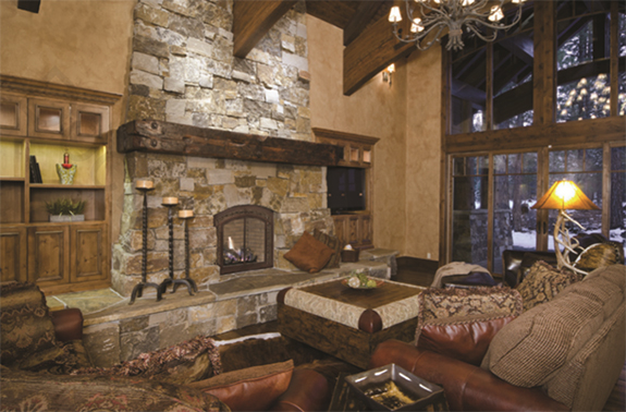 Alt: A natural rugged fireplace design with a natural wood mantel and raw stone surround.