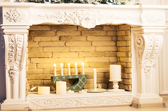 Decorative unused fireplace with candles