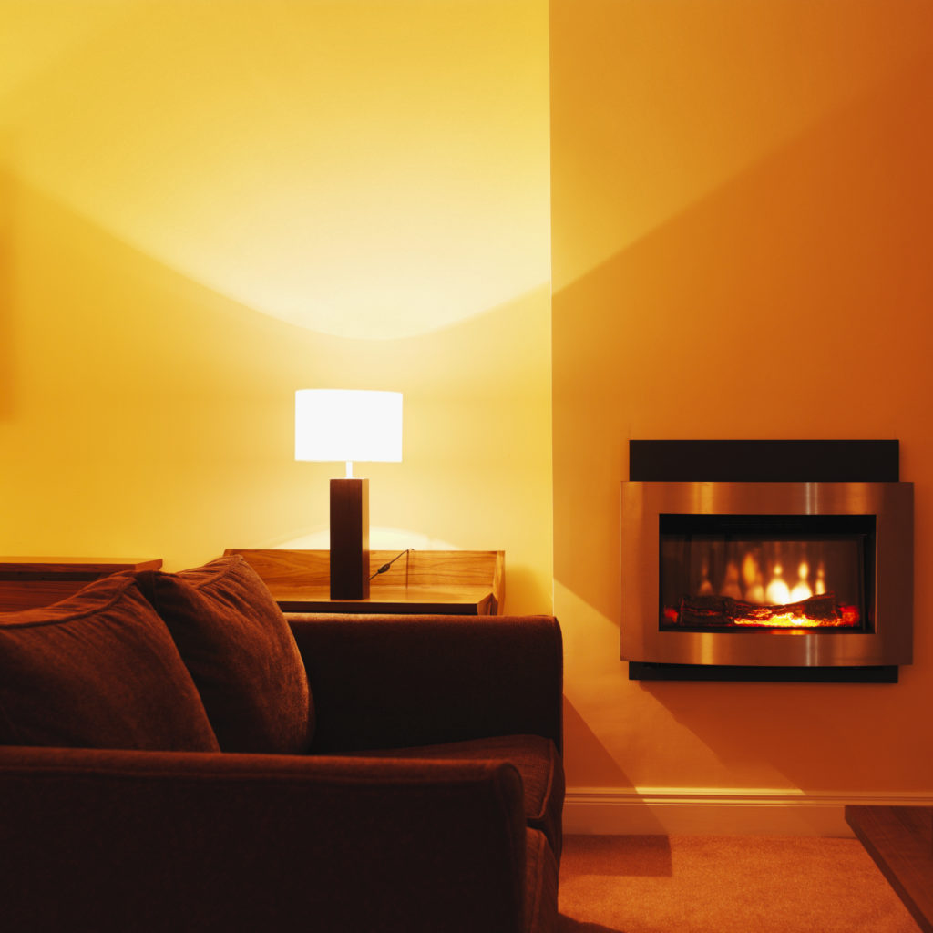 Front view of fireplace with sofa in the foreground Doctor Flue