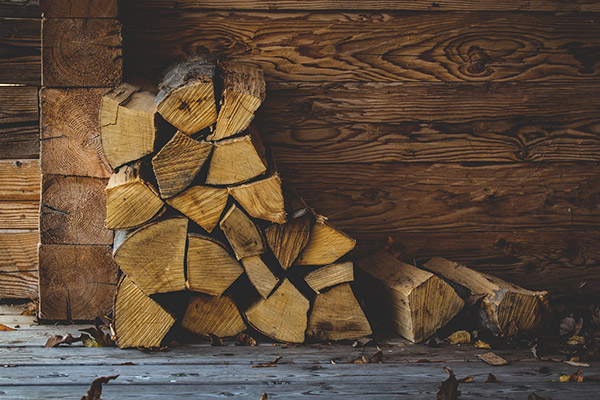 A stack of chopped and seasoned firewood logs.