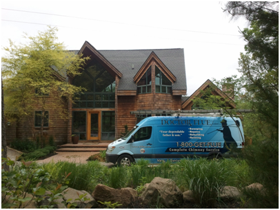 A Doctor Flue sprinter van in front of a home being professionally inspected.