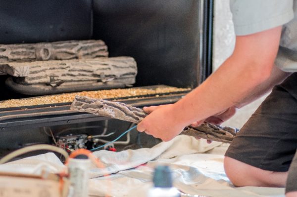 Doctor Flue employee installing a gas fireplace