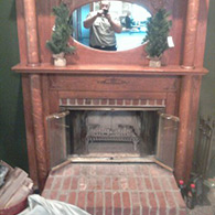 Before picture of a wood burning fireplace with some unnecessary safety risks