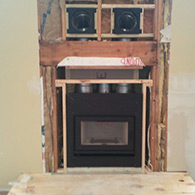 Partial installation of a High efficiency wood burning fireplace