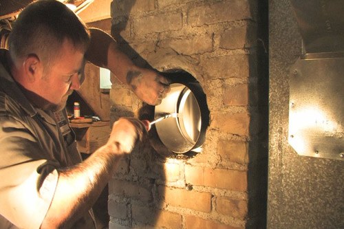 Tech working on the interior chimney