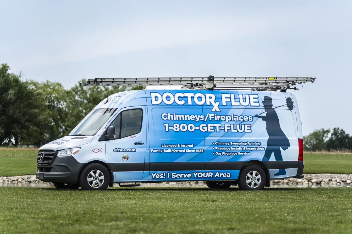 Doctor Flue service van with ladders on the roof