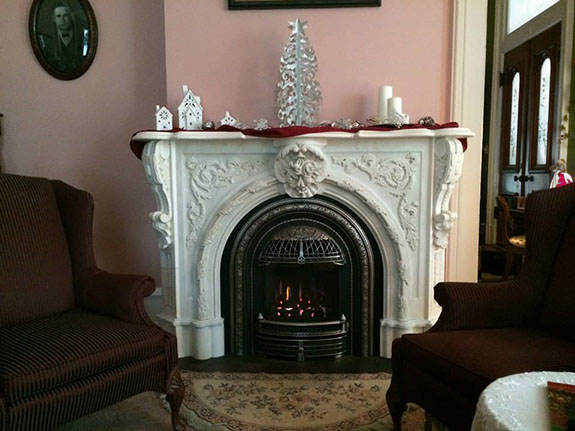 mantel decorated in modern style with silver and red theme