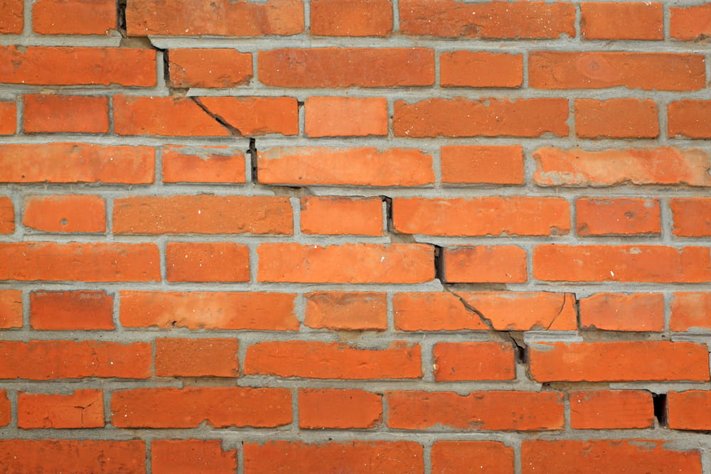 A stair-step crack on a chimney wall