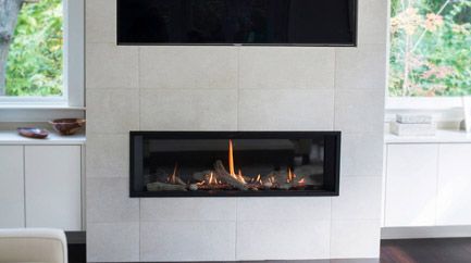 Modern gas log fireplace with a lit fire