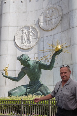 Doc stopping for a photo with the Spirit of Detroit statue
